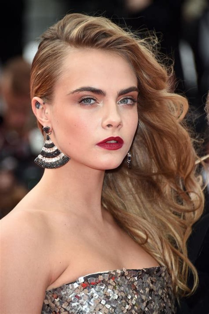 Cara Delevingne Models Light Up the amfAR Runway With RedHot Lips