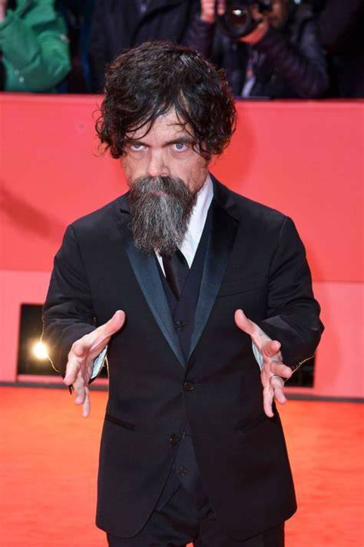 Peter Dinklage's daughter stays warm beneath a pair of enormous red ear