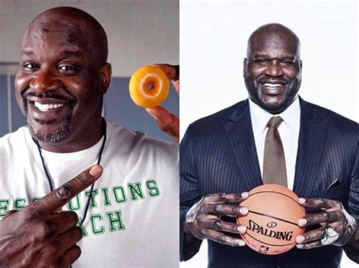 Shaq holding a totally normal sized dude r/ShaqHoldingThings